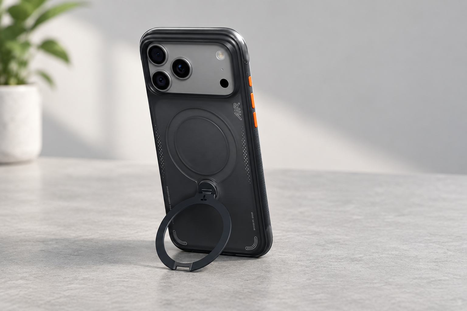 Listing-based illustration of the Shadow Black iPhone 18 Pro case standing on a desk with its ring open